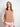 Woman wearing knitted sweater from 52 Weeks of Sweaters book.