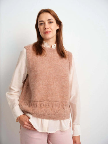 Woman wearing knitted sweater from 52 Weeks of Sweaters book.