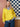 Person wearing a bright yellow sweater featured in 52 Weeks of Sweaters collection.