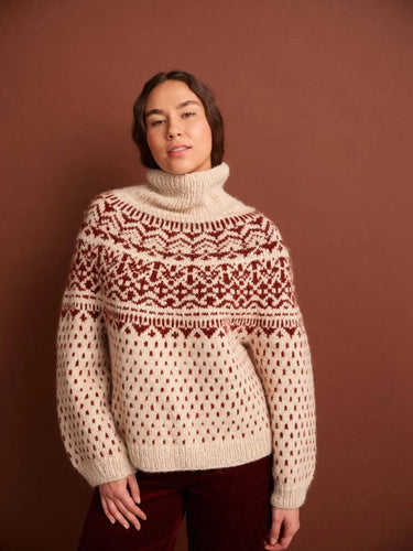 Woman wearing a knitted sweater featured in '52 Weeks of Sweaters' book, available for pre-order.
