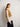 Model wearing a hand-knitted vest inspired by 52 Weeks of Sweaters book pre-order collection.