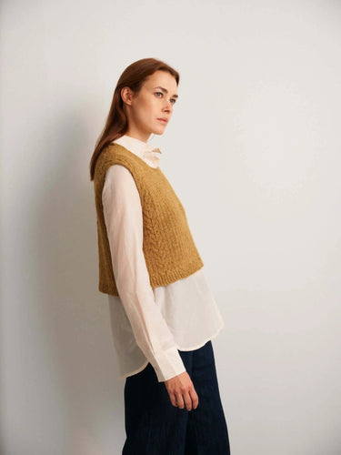 Model wearing a hand-knitted vest inspired by 52 Weeks of Sweaters book pre-order collection.