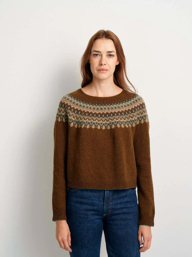 Model wearing sweater featured in 52 Weeks of Sweaters knitting book pre-order, showcasing intricate knit pattern and design.