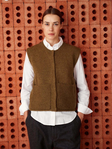 Model wearing sweater vest, featured in '52 Weeks of Sweaters' knitting book, available for pre-order.