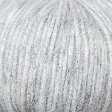 Snefnug yarn in soft light grey, featuring a luxurious blend of baby alpaca, merino wool, and organic cotton by CaMaRose.