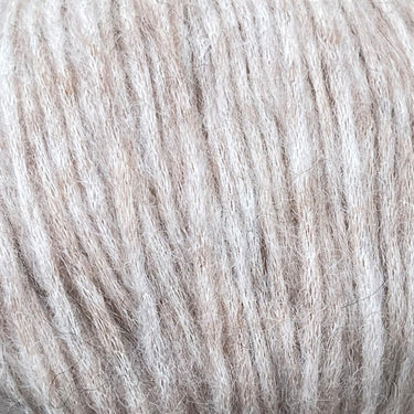 Snefnug yarn by CaMaRose, featuring a soft blend of baby alpaca, extra fine merino wool, and organic cotton in a natural beige color.