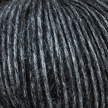 Snefnug yarn by CaMaRose in dark gray color, showcasing its soft texture made of baby alpaca, merino wool, and organic cotton blend.