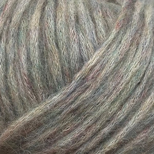 Close-up of Snefnug yarn showcasing its soft and airy texture, made from 55% baby alpaca, 10% merino wool, and 35% organic cotton.