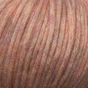 Snefnug yarn blend with baby alpaca, merino wool, and organic cotton, showcasing super soft and airy texture.