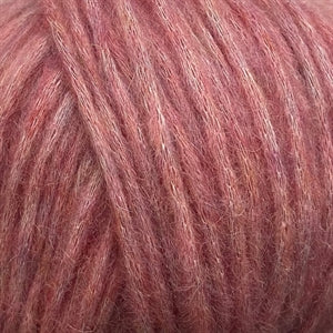 Close-up of Snefnug yarn by CaMaRose, showcasing its soft and airy texture with a blend of baby alpaca, merino wool, and organic cotton.
