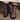 Black socks with colorful floral patterns worn by a person, standing on a carpeted floor.