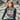 Model wearing knit sweater from ARAN by Marie Wallin collection, featuring traditional Fairisle motifs.