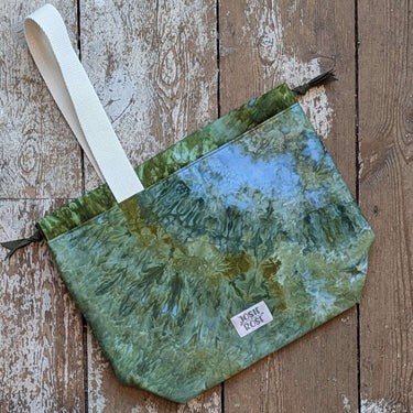 Large ice dyed cotton Craft Project Bag with green and blue hues, featuring interior pockets and a sturdy white strap.