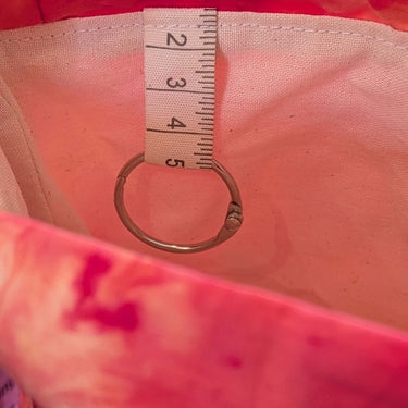 Interior view of large ice dyed Craft Project Bag with organizational pockets and a ring tab, showcasing unique craftsmanship.