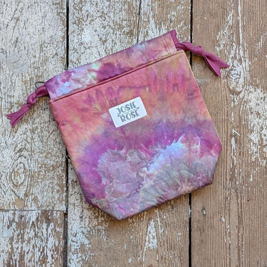 Ice Dyed Project Knitting Bag - Small with unique tie-dye design on a wooden background.