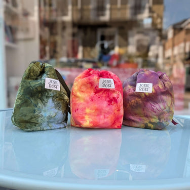 Colorful Ice Dyed Project Knitting Bags by Josie Rose on display table