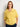 Woman wearing a yellow knitted sweater featured in the 52 Weeks of Sweaters knitting book.