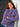 Woman wearing a purple sweater from the 52 Weeks of Sweaters collection