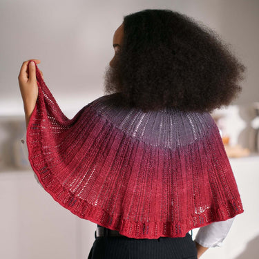 Person wearing a knitted shawl showcasing Beaded Colourwork, a modern knitting technique with beads by Jeanette Sloan.