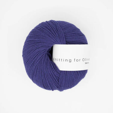 Knitting For Olive Merino yarn in deep purple, fingering weight, perfect for cozy knits and ideal for outdoor adventures.