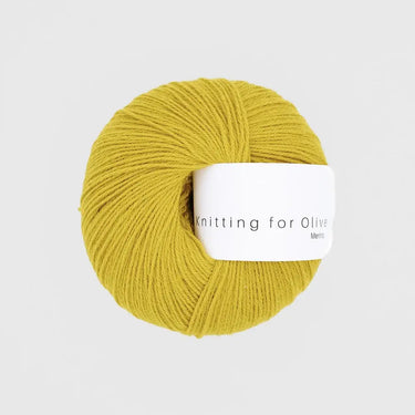 Knitting For Olive Merino yarn in yellow color, ideal for knitting, providing comfort and functionality for outdoor activities.