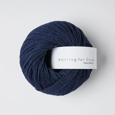 Knitting for Olive Heavy Merino yarn in dark blue, 100% Merino wool from ethical New Zealand sheep. Soft and natural fiber texture.