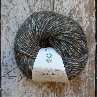 Ball of yarn with a label on a wooden surface