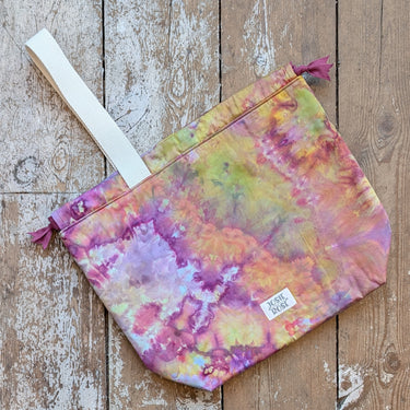 Ice Dyed Project Bags - XLarge showing colorful design and sturdy handle on wooden background.