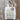 Marie Wallin tote bag with knitting pattern design on wooden floor.