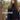 Woman wearing navy knitted sweater from Stormfell by Jonna Helin.