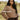 Woman modeling Jonna Helin's Haworth cardigan in a natural environment.