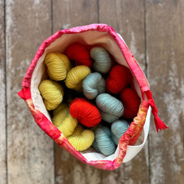 Ice Dyed Project Bags - XLarge filled with colorful skeins of yarn, showcasing unique ice dyed cotton design, perfect for craft storage.