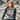 Model wearing knit sweater from ARAN by Marie Wallin collection, featuring traditional Fairisle motifs.