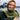 Woman wearing green knitted scarf outdoors, Archipelago Knitting