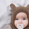 Baby Bear Balaclava Kit worn by a baby, in KFO Merino and Soft Silk Mohair at Knit With Me yarn shop