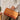 Person holding a stylish leather and woven handbag with a casual outfit