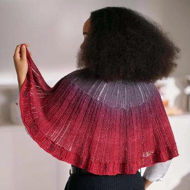 Person wearing a knitted shawl showcasing Beaded Colourwork, a modern knitting technique with beads by Jeanette Sloan.