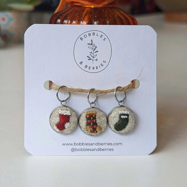 Bobbles & Berries | Stitch Marker Set | Hand-Embroidered Art, Style: Christmas Stockings, Discover Bobbles & Berries hand-embroidered stitch markers, inspired by Scottish nature. Lightweight, smooth, and perfect for mindful, snag-free knitting., Knit With