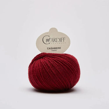 Cardiff Cashmere Classic | Sport / DK Yarn yarn ball in 628 GRANATA colour with simple background