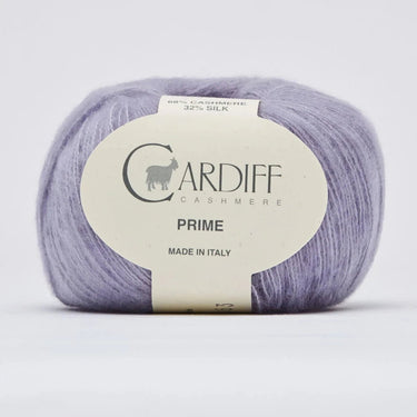 Ball of purple yarn with a Cardiff Cashmere label on a light gray background