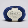 Blue skein of yarn with a Cardiff Cashmere label on a light gray background