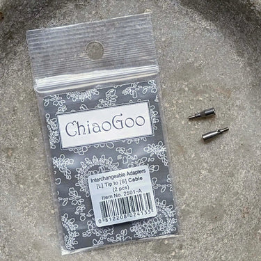 ChiaoGoo interchangeable adaptors and Knitting Cable Connectors on a textured background