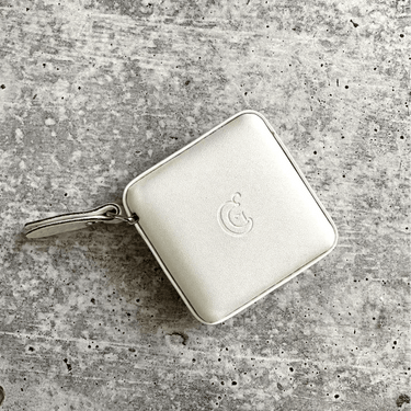 ChiaoGoo Retractable Tape Measure, white square design, measures 150cm, ideal for knitting and crochet projects, compact and efficient.