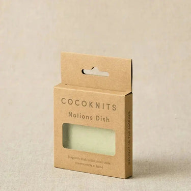 Packaging of Cocoknits Magnetic Notions Dish for organizing small metal notions like stitch markers and sewing needles.