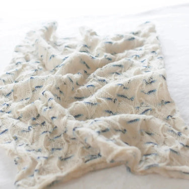 Contemplation II Cowl Knitting Kit by Chroma Nima showcasing hand-dyed cashmere yarn with lace pattern in natural light.