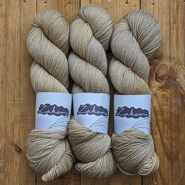 Zakami | Corriedale | Small Batch Yarn, Colour: Oatmeal, Corriedale strikes the perfect balance of hard-wearing and supple. This yarn is perfect for socks and other projects such as hats and jumpers and offers great stitch definition. It works as a wonder