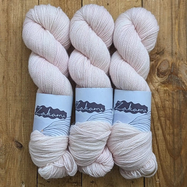 Zakami | Corriedale | Small Batch Yarn, Colour: Pink Cadalac, Corriedale strikes the perfect balance of hard-wearing and supple. This yarn is perfect for socks and other projects such as hats and jumpers and offers great stitch definition. It works as a w