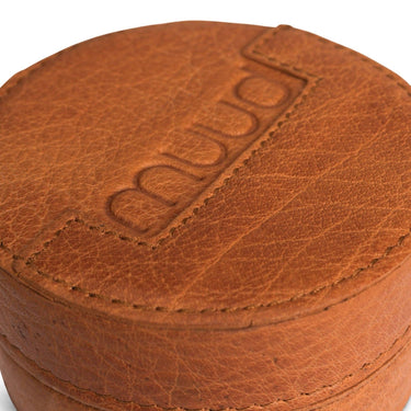 Brown leather jewelry box with 'Muud' branding on a white background