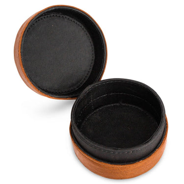 Round wooden jewelry box with black interior on a white background
