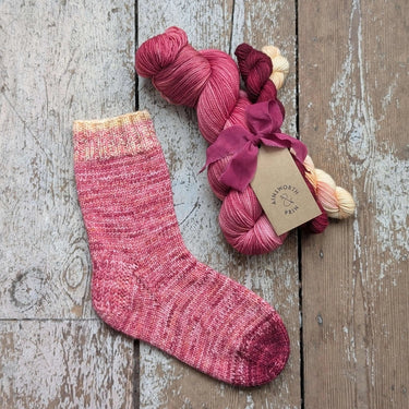 Ainsworth & Prin Flower Yarn Knitting Kits with Classic Sock skeins and ribbon for crafting.
